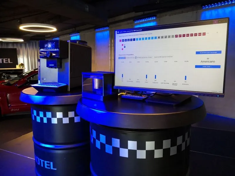 The Qoffee-Maker at a conference — a coffee machine wired to a quantum circuit composer